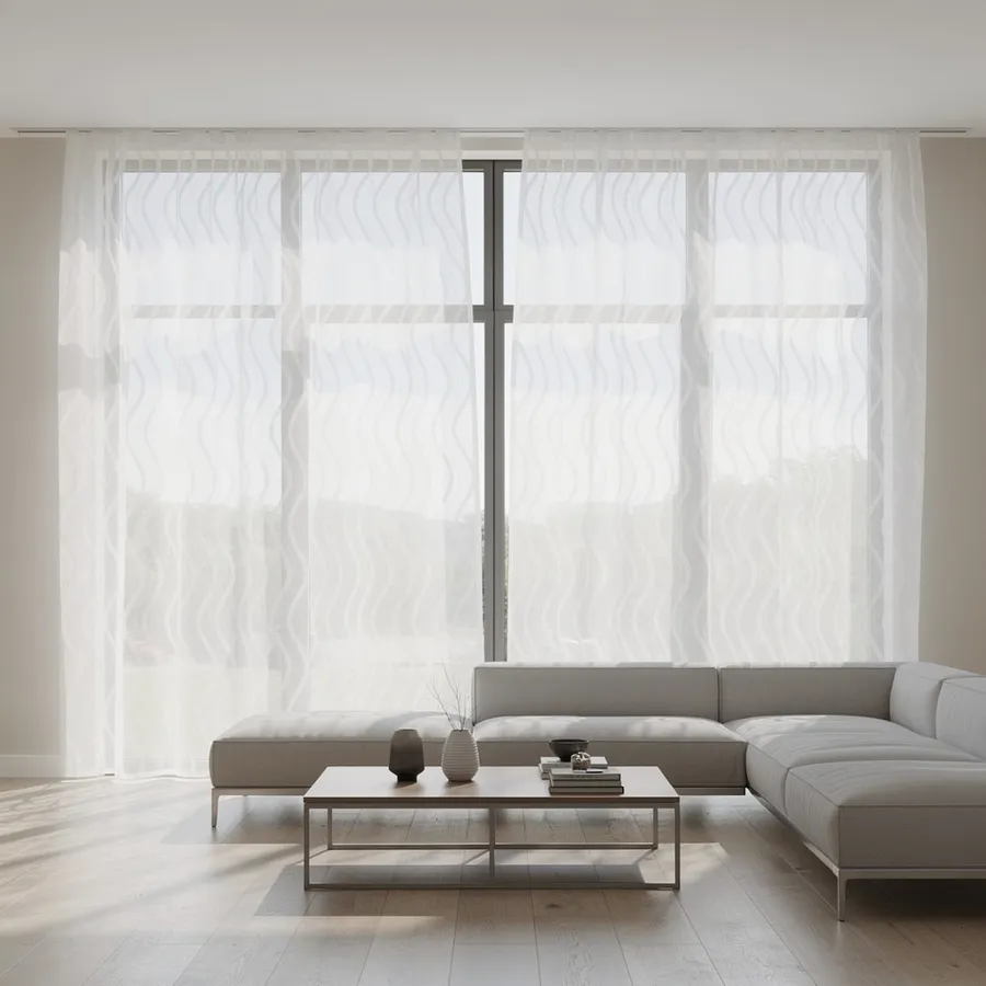 Sheer curtains across a wide living-room window